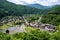 Shirakawa-go, Japan, old wooden farmhouses with thatched roofs surrounded by rice fields and high mountains