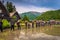 Shirakawa-go - May 27, 2019: Farmers working the rice fields in the village of Shirakawa-go, Japan