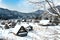 Shirakawa-go villages in snowfall day, Shirakawago famous Gassho-Zukuri houses steep thatched roofs, Village hill view point in