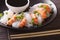 Shirataki Noodles with shrimp, green onions and soy sauce close-up. horizontal