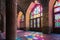 Shiraz,Iran - 04.07.2019: Interior of the Pink Mosque in Shiraz. Islamic ornaments, sun shines through colorful glass