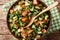 Shirazi salad of cucumbers, tomatoes, onions and herbs close-up in a bowl. Horizontal top view