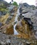 Shirlak waterfall in rocks . Altai Mountains