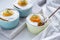 Shirred baked eggs for breakfast. Selective focus copy space