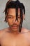 Shirtless african man with dreadlocks