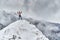 Shirtless man in the mountains winter time