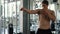 Shirtless muscular man practicing shadow boxing at the gym