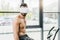 shirtless sportsman in Virtual reality headset with electrodes working out on elliptical during endurance test in gym.