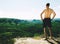 Shirtless tall caucasian man wear black shorts rests on mountain peak