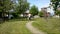 Shirtless young man jogging on pathway