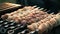 Shish kebab coocking on sticks fried on coals. 4k footage