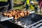 Shish kebab made from marinated pork and cooked on barbecue grill over charcoal. Traditional barbecue picnic food. Outdoor food