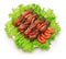 Shish kebab, tomato and green salad on white background.