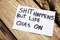 Shit happens but life goes on handwritten message on white paper with retro wooden bark background. Motivational handwritten messa