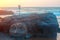 Shiva Face Rock Carving and Trident totem on Vagator Beach, Goa, India. Beautiful sunset background. Northernmost beach of Bardez