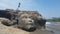 Shiva head carved in a rock on a beach in India