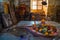 Shiva Lingam temple interior ornate with flowers and colors with majestic light coming from window, India. Architectural details o