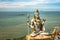 Shiva statue  at murdeshwar temple aerial shots with arabian sea in the backdrop
