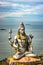 Shiva statue  at murdeshwar temple aerial shots with arabian sea in the backdrop