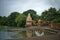 Shiva temple and bell tower on the bank of river krishna in rainy season