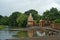 Shiva temple and bell tower on the bank of river krishna in rainy season