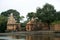 Shiva temple and bell tower on the bank of river krishna in rainy season