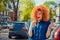 Shocked anxious scared young girl talking at phone receiving bad