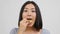Shocked Asian Female Eating Potatoes Chips On White Studio Background