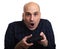 Shocked bald man playing video game