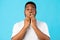 Shocked Black Guy Covering Mouth Looking At Camera, Blue Background