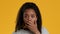 Shocked Black Teen Girl Covering Mouth With Hand, Yellow Background