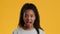 Shocked Black Teenager Girl Opening Mouth Posing Over Yellow Background