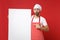 Shocked chef cook or baker man in striped apron white t-shirt toque chefs hat isolated on red background. Cooking food