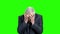 Shocked elderly businessman, green screen.