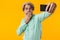 Shocked grey-haired man take a selfie by mobile phone