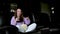 Shocked little teen children girl watching comedy video tv program or movie film content on tv, eating popcorn on