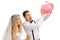 Shocked newlywed couple shaking an empty piggybank