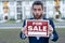 shocked sale property by salesman. man salesman hold board for sale property.
