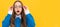 Shocked school aged girl child in spectacles with amazed look yellow background, amazement. Child face, horizontal