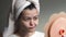 Shocked upset woman with towel on head look in mirror and feel stressed about facial skin problem