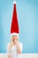 Shocked woman having crazy windblown santa hat