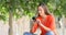 Shocked woman on phone in a park