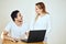 Shocking couple reading bills together sitting desk at home