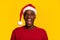 Shocking Sales. Amazed Black Guy In Santa Hat Posing With Open Mouth