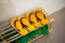 Shoe Rack with yellow and green rubber sandal or slippers.