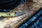 Shoe repair. Old sharp knife lying on a wooden table. Working place of a shoemaker closeup. Wooden background