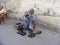 Shoeblack man cleaning shoes