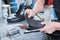 Shoemaker repair shoe. Glueing the sole for male footwear