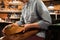 Shoemaker sitting in workshop making shoes