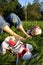 Shoes and bare feet on grass